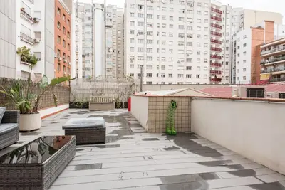 a balcony with a view of buildings at The Collection Barcelona - Eixample 3BD Apartment with Private Terrace in Barcelona