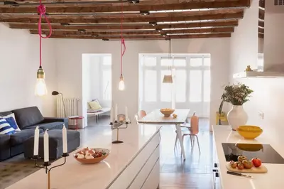 a living room with a couch and a table at GuestReady - Acogedor piso al lado de Pl. Cataluña in Barcelona