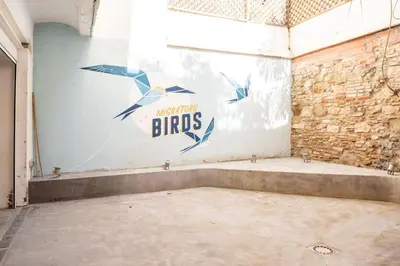 a room with a wall with a bros sign on it at GuestReady - Unique Retreat in Barcelona in Barcelona