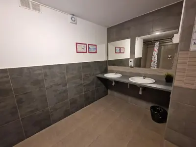 a bathroom with two sinks and a mirror at Arc House Barcelona in Barcelona
