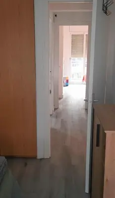 an empty room with a hallway leading to a door at Apartment close to the beach and the town centre in Castelldefels