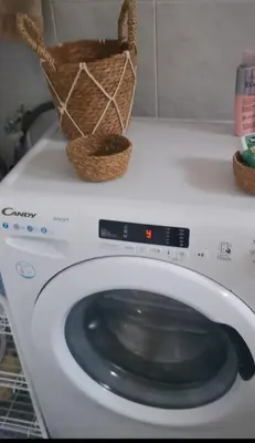 a washing machine with a basket on top of it at Apartment close to the beach and the town centre in Castelldefels