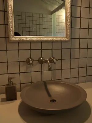 a sink in a bathroom with a mirror at Ca l'Agnès in Montseny