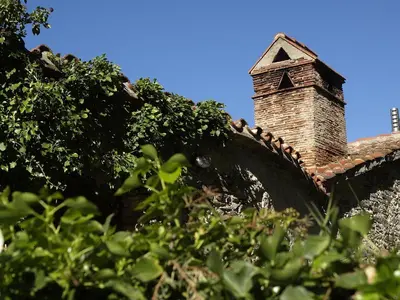 a brick chimney on top of a roof at Ca l'Agnès in Montseny
