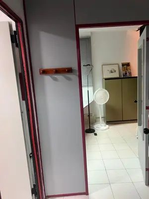 a hallway with a door open to a room with a fan at Tessasapartments Sabadell 2 in Sabadell