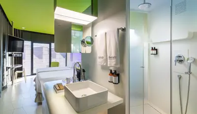 a bathroom with a sink and a shower at Barceló Raval in Barcelona