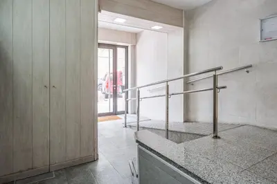 a bathroom with a metal railing in a room at GuestReady - Comfortable Retreat next to the beach in Barcelona