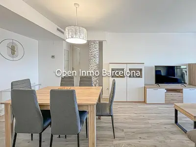 a dining room with a wooden table and chairs at Apartamento marítimo en Cubelles - OI01958 in Cubelles