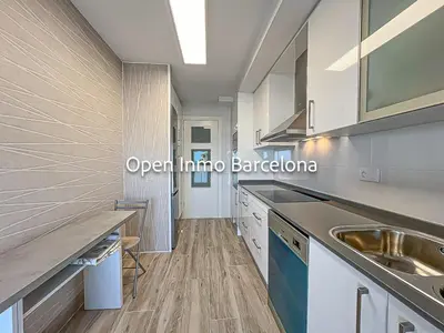 a kitchen with white cabinets and a sink at Apartamento marítimo en Cubelles - OI01958 in Cubelles