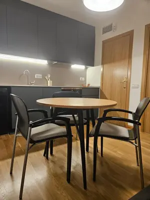 a dining room with a table and chairs in a kitchen at EstudioSueñosSuite in Sant Just Desvern