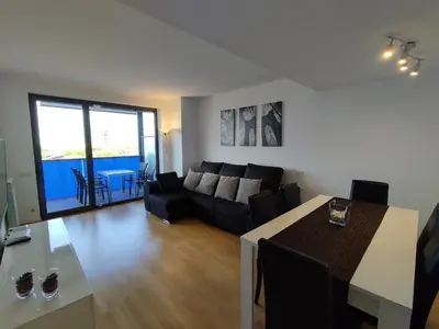 a living room with a couch and a table at Apartment Airport Barcelona Premium in Viladecáns