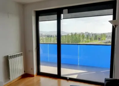 a room with a large window with a view at Apartment Airport Barcelona Premium in Viladecáns