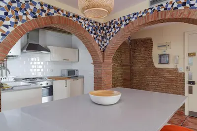 a kitchen with a table with a bowl on it at GuestReady - Un pequeño paraíso en Barcelona in Barcelona