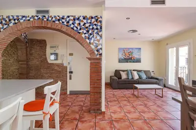 a living room with a couch and a table at GuestReady - Un pequeño paraíso en Barcelona in Barcelona