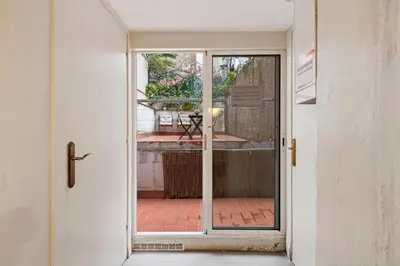 an open door with a view of a patio at Flateli Fabra in Barcelona