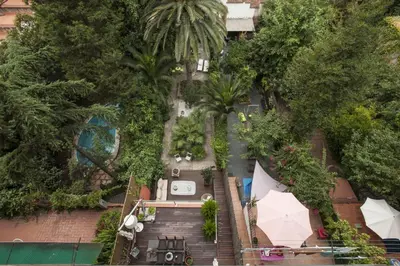 an overhead view of a garden with palm trees at Flateli Mallorca-Passeig de Gracia in Barcelona