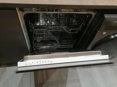 an oven with its door open with food inside at La Fira - Paralelo 1 in Barcelona