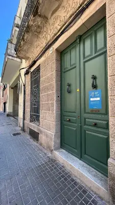 a pair of green doors on a building at Hotelito Boutique Badalona Gran Villa in Badalona
