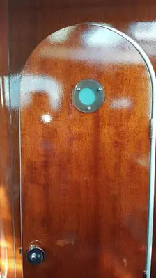 a glass shower door with a button on it at AMAZING FLAT IN CLASSIC SAILING BOAT in BARCELONA in Barcelona
