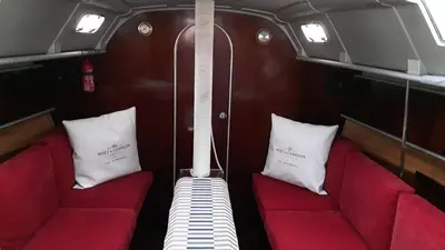 a room with two red seats and two white pillows at AMAZING FLAT IN CLASSIC SAILING BOAT in BARCELONA in Barcelona