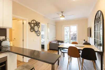 a kitchen and living room with a table and chairs at Besos Apartment Barcelona in Sant Adria de Besos