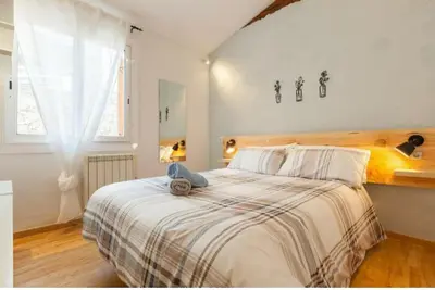 a bedroom with a bed with a stuffed animal on it at La Casita de Caldetes in Caldes d'Estrac