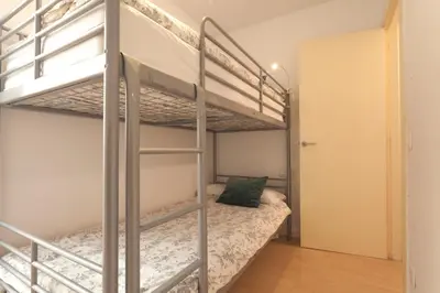 a bedroom with two bunk beds in a room at Plaza Catalunya City Center Apartments in Barcelona