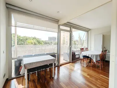 a white bathroom with a toilet and a sink at Bright 2 Bedroom Apartment with 2 Terraces Pool and Parking near Diagonal Mar Beach in Sant Adria de Besos