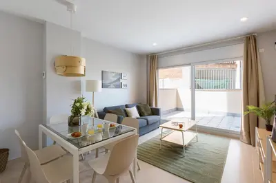 a living room with a table and a couch at 4235 - AB Santa Coloma 3 B-I in Santa Coloma