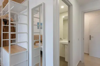 a white closet with a mirror and a sink at 4235 - AB Santa Coloma 3 B-I in Santa Coloma