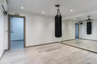 a room with two boxing bags hanging on the wall at 4236 - AB Santa Coloma III in Santa Coloma