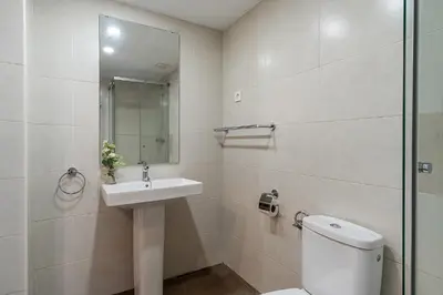 a bathroom with a toilet and a sink and a shower at 4237 - AB Santa Coloma III in Santa Coloma