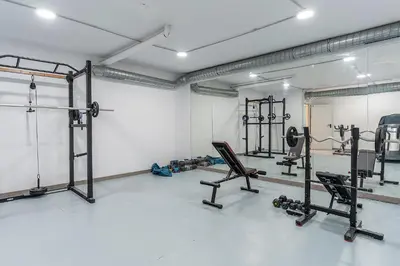a gym with several exercise equipment in a room at 4237 - AB Santa Coloma III in Santa Coloma