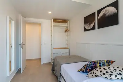 a small bedroom with a bed and a closet at 4238 - AB Duplex Santa Coloma III in Santa Coloma
