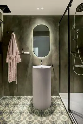 a bathroom with a sink and a mirror at Luxury Apt with King Beds & Central AC in Heart of BCN in Barcelona