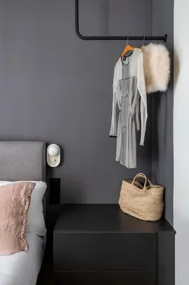 a bedroom with a bed and a black dresser with a basket at Luxury Apt with King Beds & Central AC in Heart of BCN in Barcelona