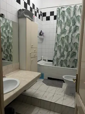 a bathroom with a sink and a tub and a toilet at Luz's Hut in Barcelona