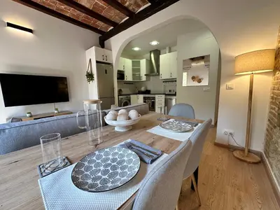 a bedroom with a large bed and two lights at Sant Pau Modernista in Barcelona