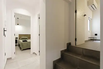 a hallway with stairs leading to a bedroom at Mediterranean Bliss in Sant Adria de Besos