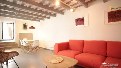 a dining room with a white table and chairs at Charming Casa in Sitges centre & minutes to beach in Sitges