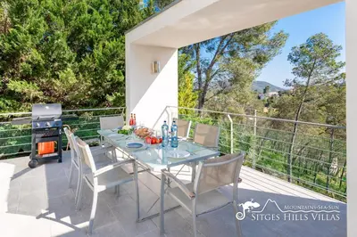 an exterior view of a house with a swimming pool at Villa Lucere with private pool near Sitges in Olivella