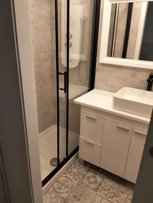a bathroom with a shower and a sink at Warm Harbor in Santa Coloma de Gramanet
