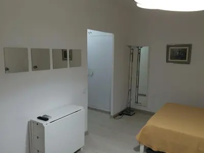a white room with a bed and a white cabinet at Marbel 2 in Barcelona