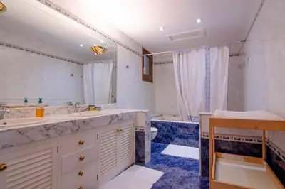 a large bathroom with two sinks and a tub at Mas Llavaneres in Sant Andreu de Llavaneres
