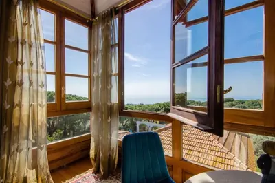 a bedroom with two beds and a mirror at Mas Llavaneres in Sant Andreu de Llavaneres