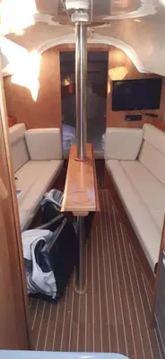 a small room with a table in the back of a boat at Velero Viko S30 in Sitges