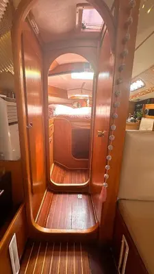 a small room with a bed and a mirror at Velero Draco in Sitges