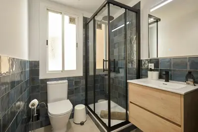 a bathroom with a toilet and a shower and a sink at 17 Nice apartment next to El Molino in Barcelona