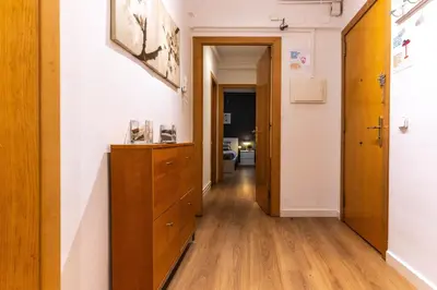 a hallway with a wooden dresser in a room at Nuevo apartamento zona Paseo de Gracia in Barcelona