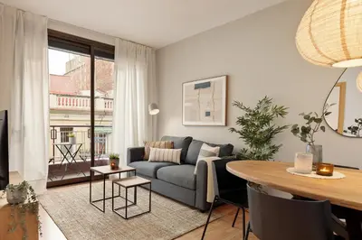 a living room with a couch and a table at Precioso apartamento en el Centro in Barcelona